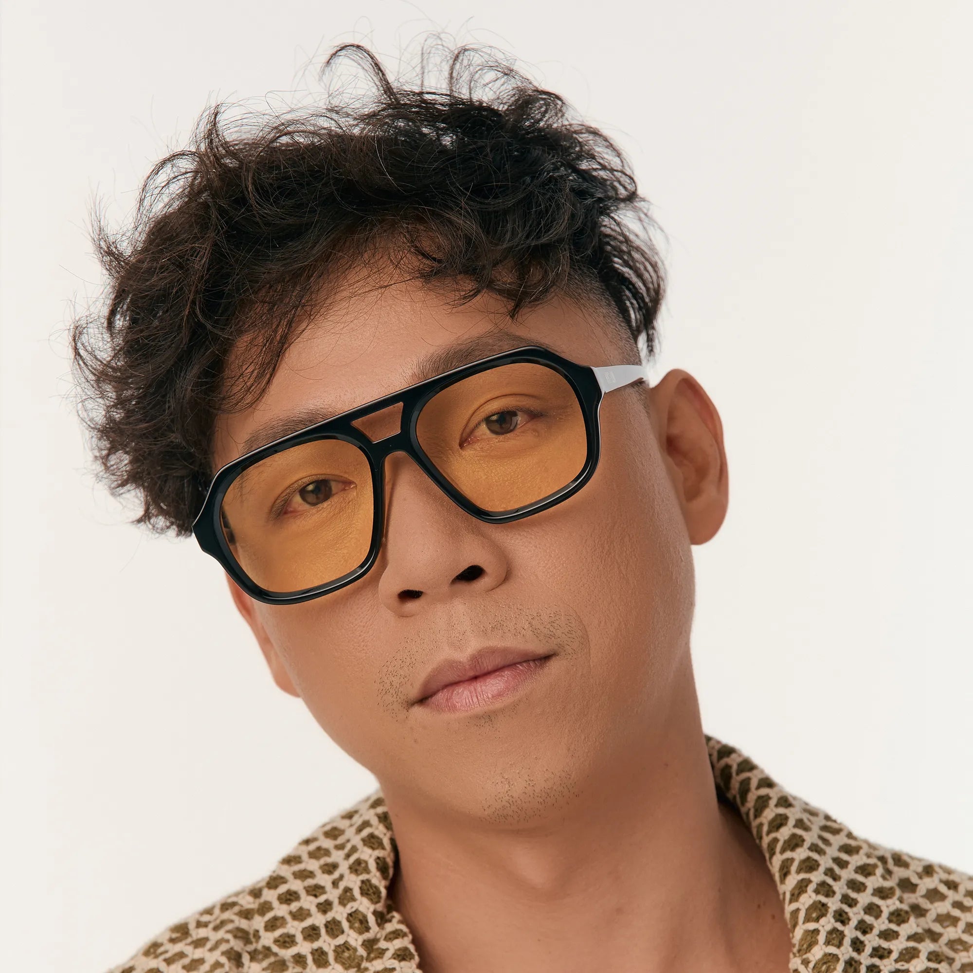 Yue-yellow-aviator-sunglasses-low-nose-bridge-side-on-model-male-studio-hyesun.webp