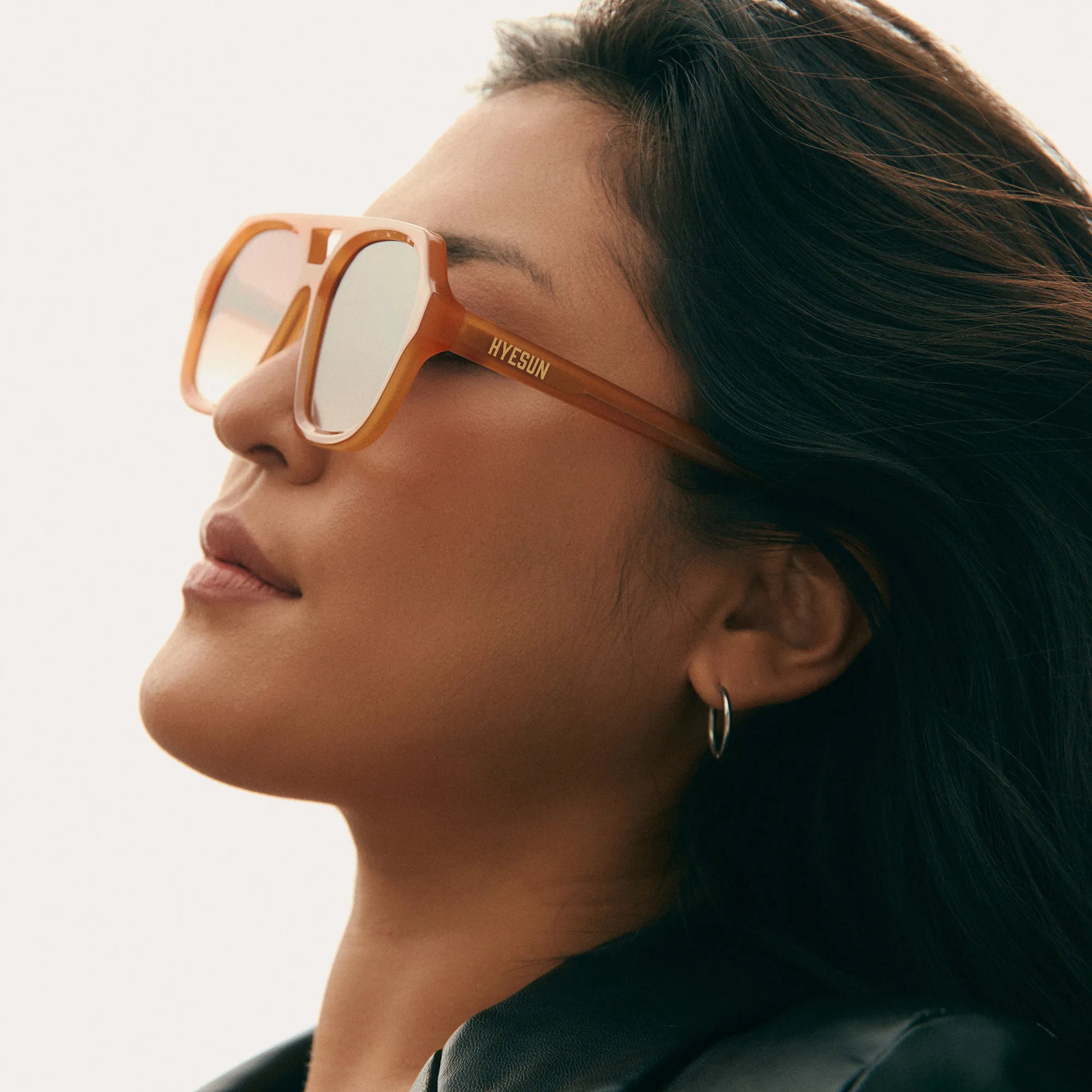 Yue-amber-aviator-sunglasses-low-nose-bridge-front-on-model-lifestyle-hyesun.webp