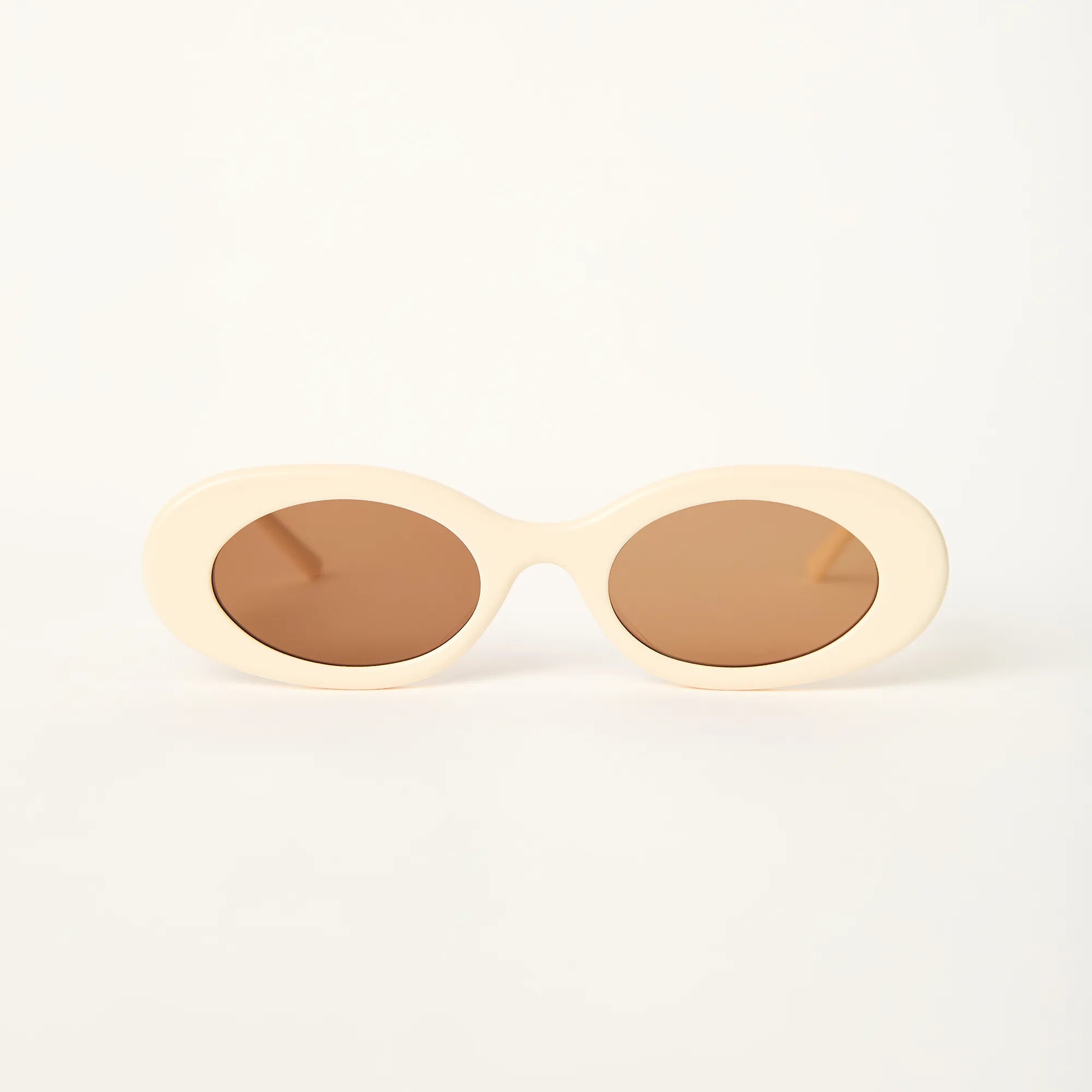ara-cream-oval-sunglasses-low-nose-bridge-front-hyesun.webp